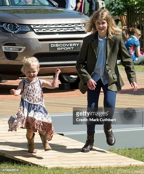 Lady Louise Windsor plays with Isla Phillips at the Royal Windsor Horse show in the private grounds of Windsor Castle on May 16, 2015 in Windsor,...