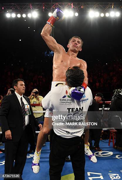 Boxer Gennady Golovkin from Kazakhstan celebrates after knocking out Willie Monroe Jr. Of the US in the sixth round during their Middleweight World...