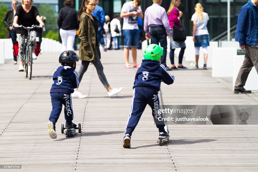 Race of boys on scooters