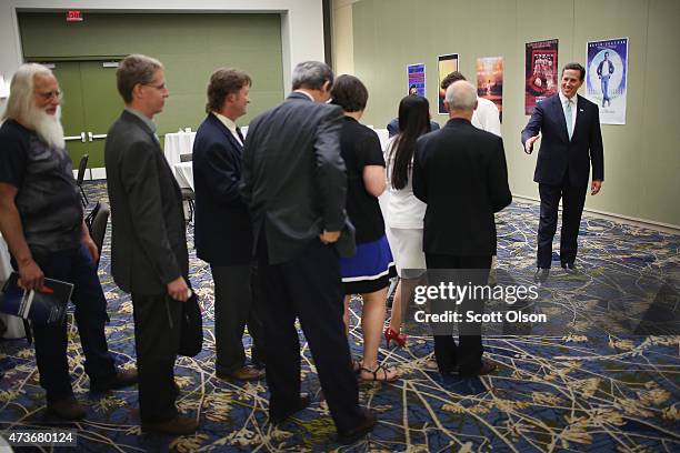 Former Pennsylvania Senator Rick Santorum greets guests at the Republican Party of Iowa's Lincoln Dinner at the Iowa Events Center on May 16, 2015 in...