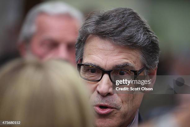 Former Texas Governor Rick Perry greets guests at the Republican Party of Iowa's Lincoln Dinner at the Iowa Events Center on May 16, 2015 in Des...