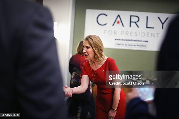 Former business executive Carly Fiorina greets guests at the Republican Party of Iowa's Lincoln Dinner at the Iowa Events Center on May 16, 2015 in...