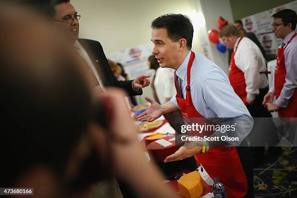 Wisconsin Governor Scott Walker greets guests at the Republican Party of Iowa's Lincoln Dinner at the Iowa Events Center on May 16, 2015 in Des...