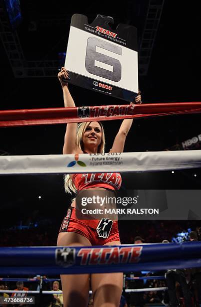 Round Card girl signals the start of the sixth round where boxer Gennady Golovkin from Kazakhstan knocked out Willie Monroe Jr. Of the US during...