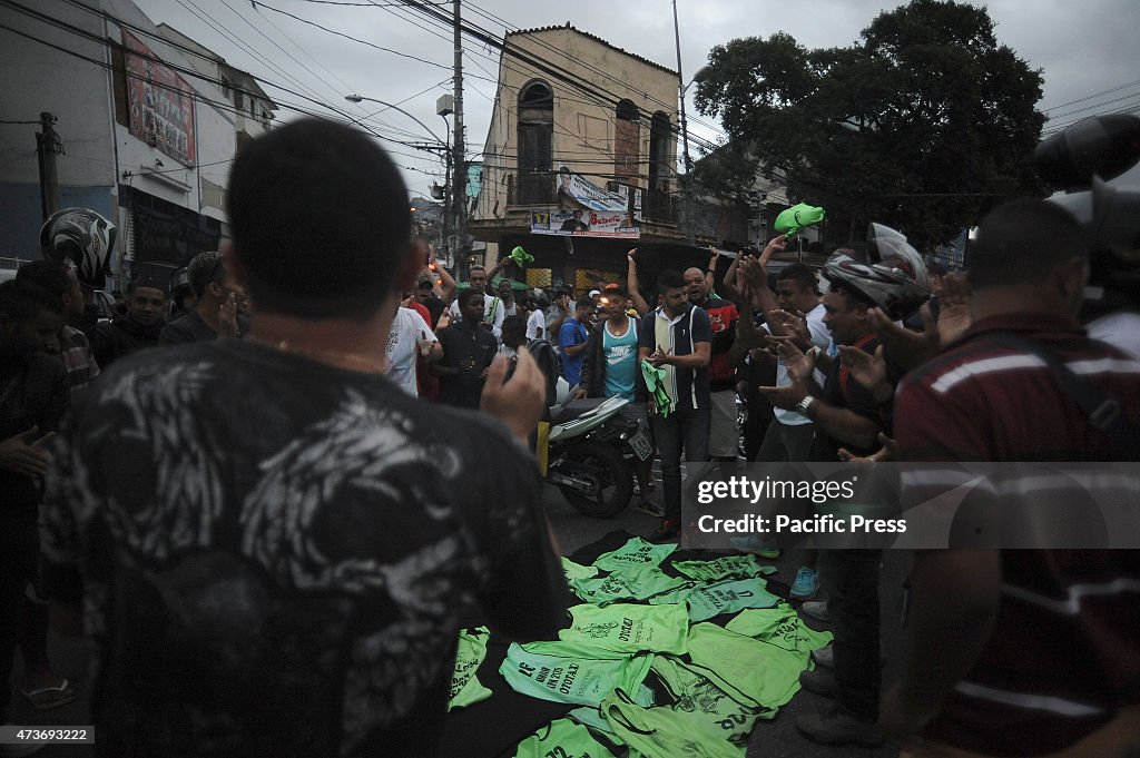 Couriers and residents of Morro São Carlos central area of...