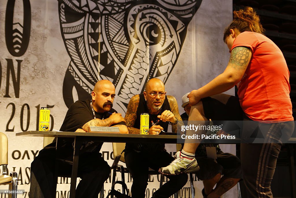 A participant of a tattoo competition shows off his tattoo...