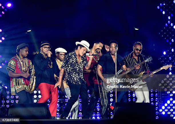 Saxophone player Dwayne Dugger, singer Philip Lawrence, trumpet player James King, singer Bruno Mars, trombone player Kameron Whalum, bass player...