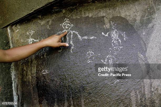Some paintings resembling the human form on the composition of large rocks in the village on the island of Siau Paseng; from the stories of local...