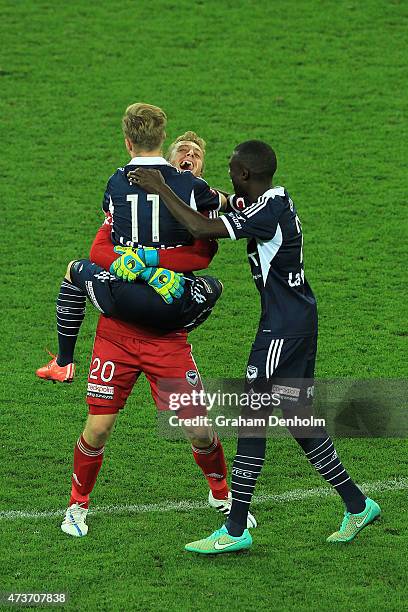 Lawrence Thomas of Melbourne Victory embraces Connor Pain after winning the 2015 A-League Grand Final match between the Melbourne Victory and Sydney...