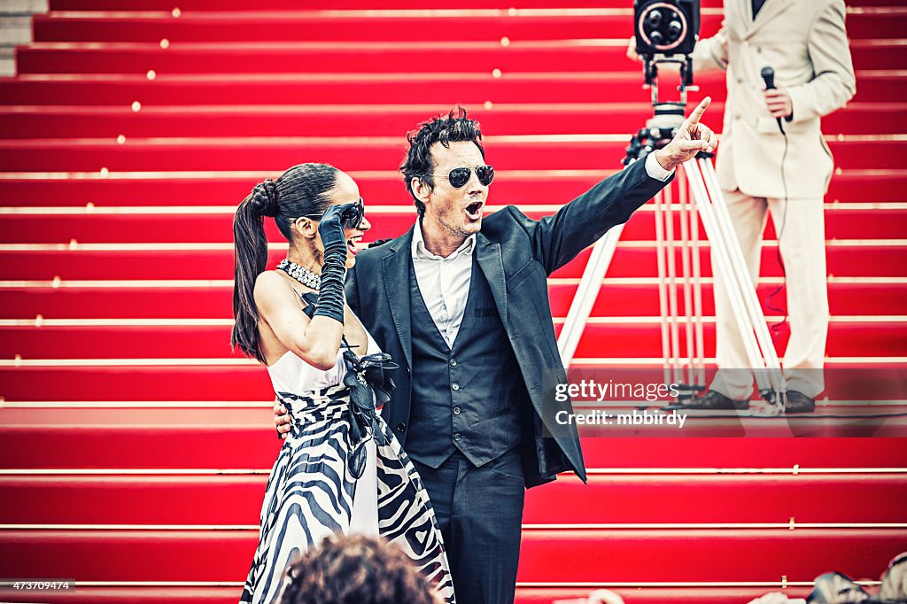 Celebrity couple on red carpet in Cannes