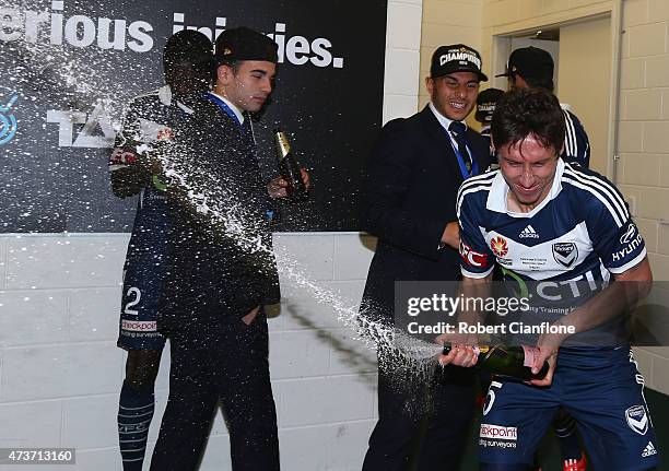 Mark Milligan of the Victory celebrates in the rooms after the Victory defeated Sydney FC the 2015 A-League Grand Final match between the Melbourne...