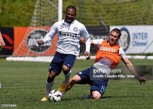 Hugo Campagnaro and Joel Obi compete for the ball during FC Internazionale training session at the club's training ground at Appiano Gentile on May...