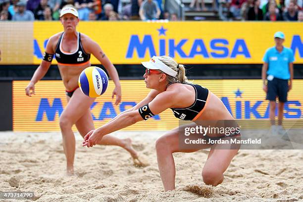 Karla Borge of Germany reaches for a ball as Britta Buthe of Germany watches on during the Women's Semi-Final match between Barbara Hansel and...