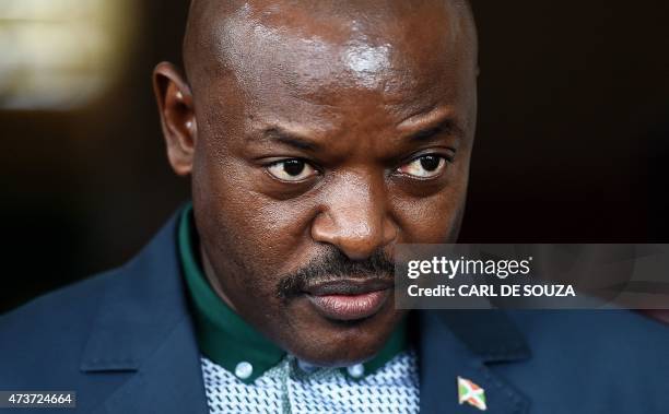 Burundi's President Pierre Nkurunziza stands at the President's office in Bujumbura on May 17, 2015 as he made his first official appearance since an...