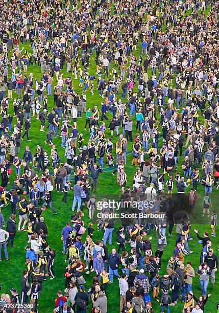 General view as football fans play kick-to-kick on the ground after the final siren during the round seven AFL match between the Richmond Tigers and...
