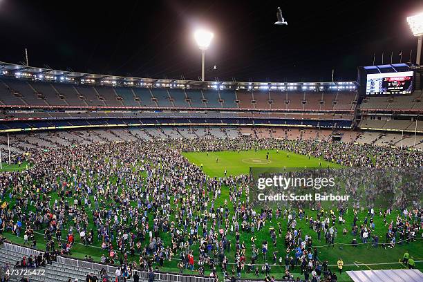 General view as football fans play kick-to-kick on the ground after the final siren during the round seven AFL match between the Richmond Tigers and...