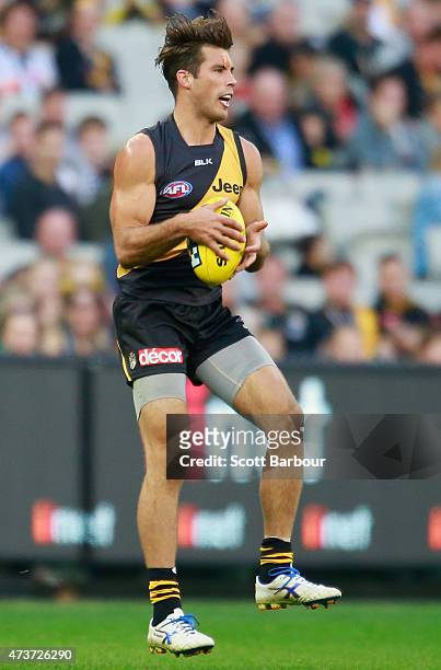 Alex Rance of the Tigers runs with the ball during the round seven AFL match between the Richmond Tigers and the Collingwood Magpies at the Melbourne...