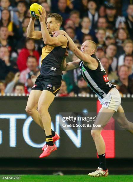 Brett Deledio of the Tigers takes a mark then kicks a goal during the round seven AFL match between the Richmond Tigers and the Collingwood Magpies...