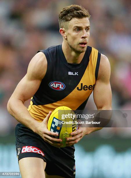 Brett Deledio of the Tigers runs with the ball during the round seven AFL match between the Richmond Tigers and the Collingwood Magpies at the...