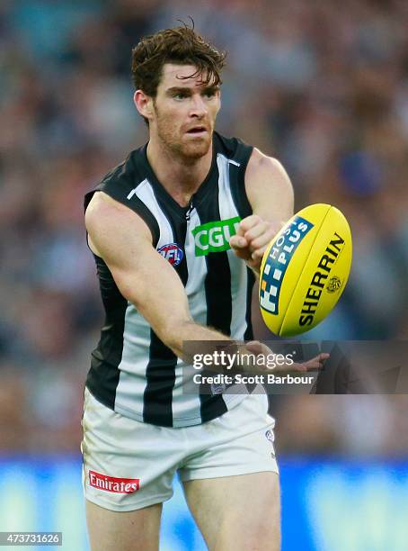 Tyson Goldsack of the Magpies runs with the ball during the round seven AFL match between the Richmond Tigers and the Collingwood Magpies at the...