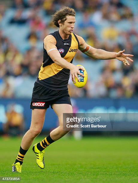 Tyrone Vickery of the Tigers runs with the ball during the round seven AFL match between the Richmond Tigers and the Collingwood Magpies at the...