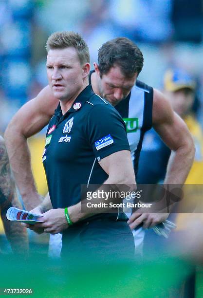 Nathan Buckley, coach of the Magpies speaks to Travis Cloke during the round seven AFL match between the Richmond Tigers and the Collingwood Magpies...