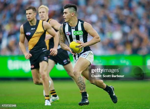 Marley Williams of the Magpies runs with the ball during the round seven AFL match between the Richmond Tigers and the Collingwood Magpies at the...