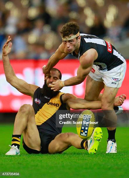 Bachar Houli of the Tigers is tackled by Jarryd Blair of the Magpies during the round seven AFL match between the Richmond Tigers and the Collingwood...