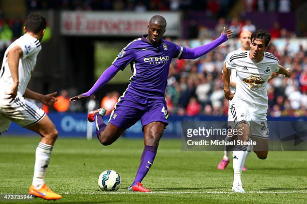 Yaya Toure of Manchester City scores his team's third goal during the Barclays Premier League match between Swansea and Manchester City at the...