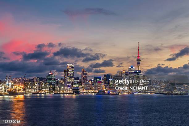 auckland city with dramatic sunset sky - auckland stock pictures, royalty-free photos & images