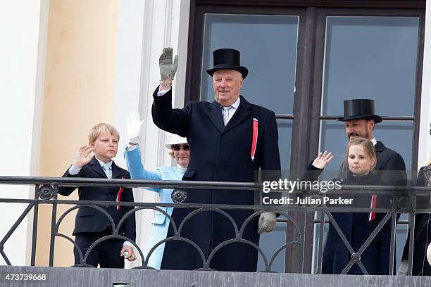 King Harald of Norway with his grandchildren, Prince Sverre Magnus, and Princess Ingrid Alexandra of Norway, on the balcony of The Royal Palace in...