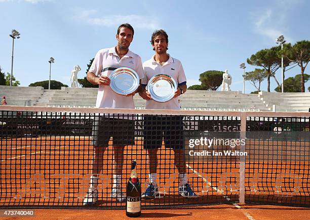 Pablo Cuevas of Argentina and David Marrero of Spain celebrates winning with the trophys after their Men's Doubles Final match against Marcel...