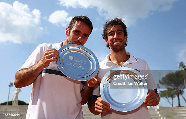 Pablo Cuevas of Argentina and David Marrero of Spain celebrates winning with the trophys after their Men's Doubles Final match against Marcel...