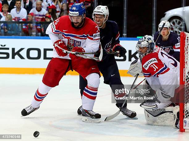 Petr Caslava of Czech Republic and Jeremy Morin of USA battle for the puck during the IIHF World Championship bronze medal match between Crech...