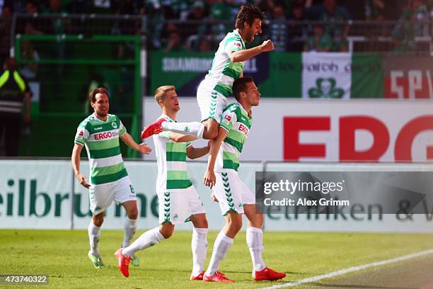 Marco Stiepermann of Greuther Fuerth celebrates his team's first goal with team mates Marco Caligiuri, Johannes Wurtz and Stephan Fuerstner during...