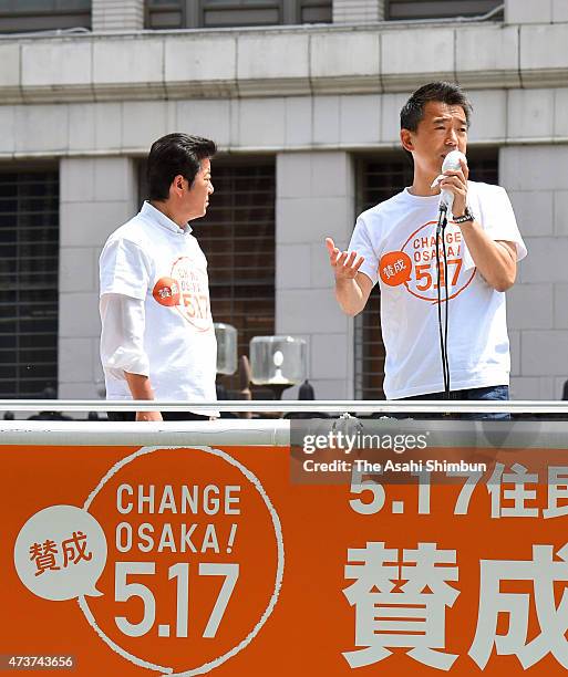 Osaka City Mayor Toru Hashimoto makes a street speech while Osaka Prefecture Governor Ichiro Matsui listens on the voting day of the referendum on...