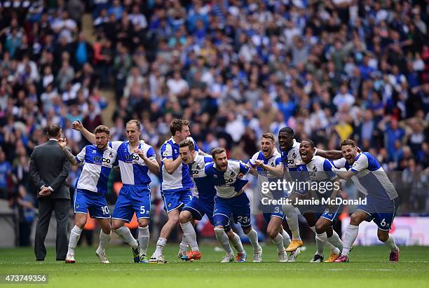 The Bristol Rovers players celebrate as Lee Mansell of Bristol Rovers scores the winning penalty in the shoot out during the Vanarama Conference...