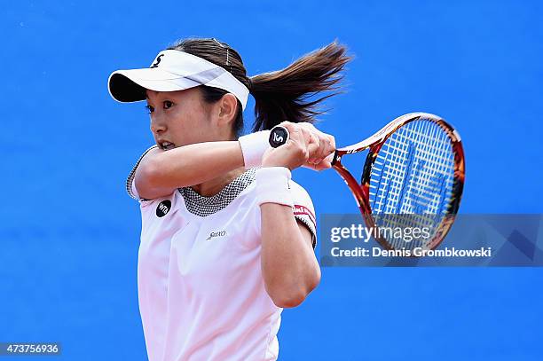 Misaki Doi of Japan plays a backhand in her match against Yuliya Beygelzimer of Ukraine during Day Two of the Nuernberger Versicherungscup 2015 on...