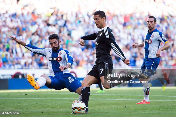 Cristiano Ronaldo of Real Madrid CF kicks the ball next to Alvaro Gonzalez of RCD Espanyol during the La Liga match between RCD Espanyol and Real...