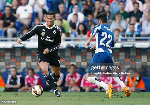 Cristiano Ronaldo of Real Madrid and Álvaro González of Espanyol compete for the ball during the mach Liga between Real Madrid CF at Espanyol at...