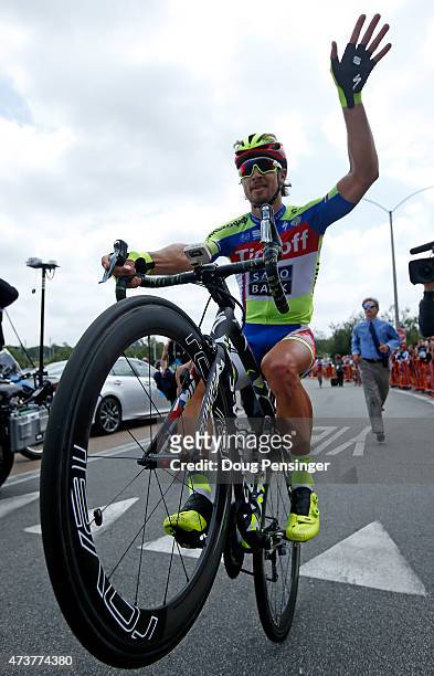 Peter Sagan of Slovakia riding for Tinkoff-Saxo does a wheelie after finishing third in stage eight and winning the general classification of the...