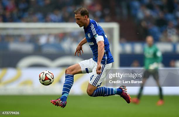 Benedikt Howedes of Schalke 04 runs with the ball during the Bundesliga match between FC Schalke 04 and SC Paderborn at Veltins Arena on May 16, 2015...