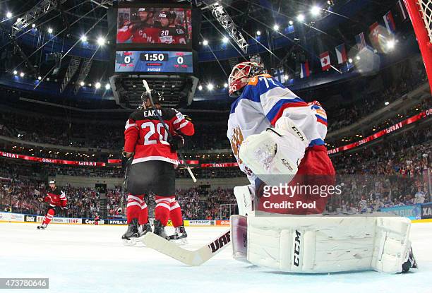 Cody Eakin of Canada celebrates after scoring the opening goal whilst dejected goaltender Sergei Bobrovski of Russia looks on during the 2015 IIHF...