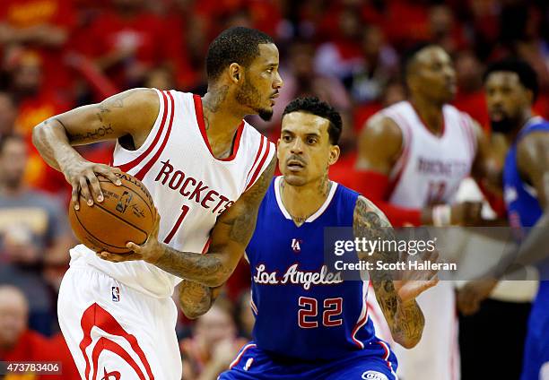 Trevor Ariza of the Houston Rockets drives against Matt Barnes of the Los Angeles Clippers in the third quarter during Game Seven of the Western...