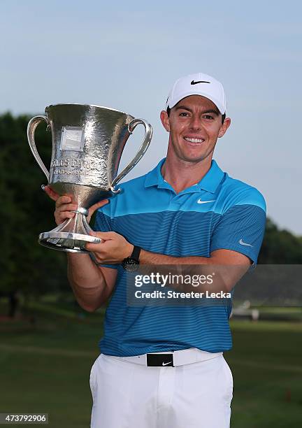 Rory McIlroy of Northern Ireland poses with the trophy after his win on the 18th hole during the final round at the Wells Fargo Championship at Quail...