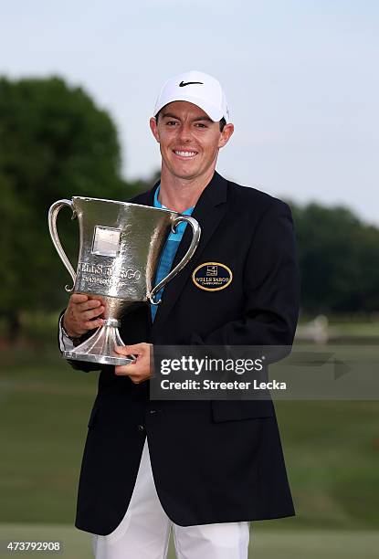 Rory McIlroy of Northern Ireland poses with the trophy after his win on the 18th hole during the final round at the Wells Fargo Championship at Quail...