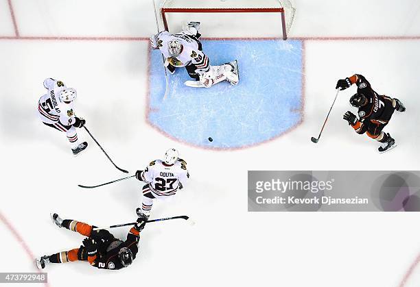 Kyle Palmieri of the Anaheim Ducks and teammate Andrew Cogliano watch the puck get past Johnny Oduya, David Rundblad and eventually goaltender Corey...