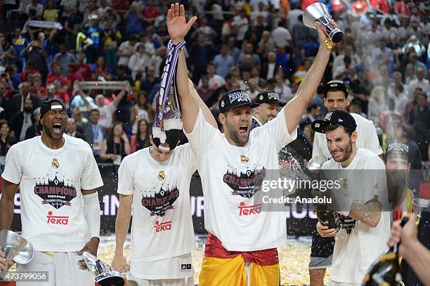 Spanish basketball team Real Madrid players celebrate after they have beaten their Greek opponents Olympiacos 78-59 in the final match at Barclaycard...