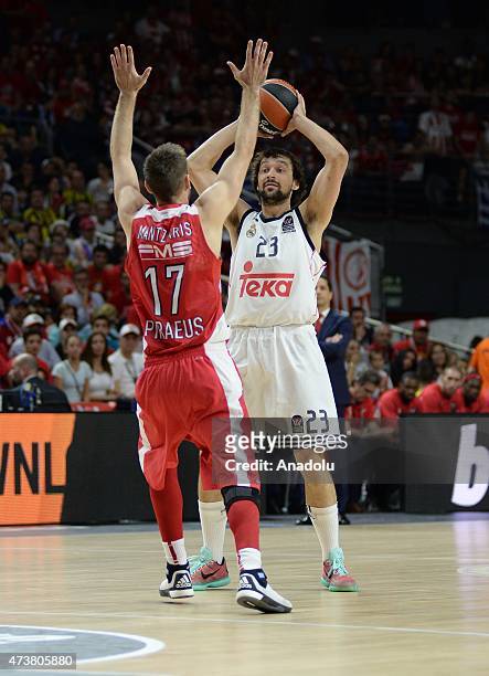 Sergio Llull of Real Madrid in action against Manzelis Mantzaris of Olympiacos Piraeus during the Turkish Airlines Euroleague final match match at...