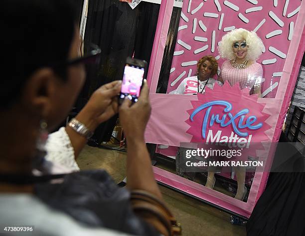 Drag Queen Trixie Mattel poses with fans during the inaugural RuPauls DragCon at the Los Angeles Convention Center, California on May 17, 2015. The...